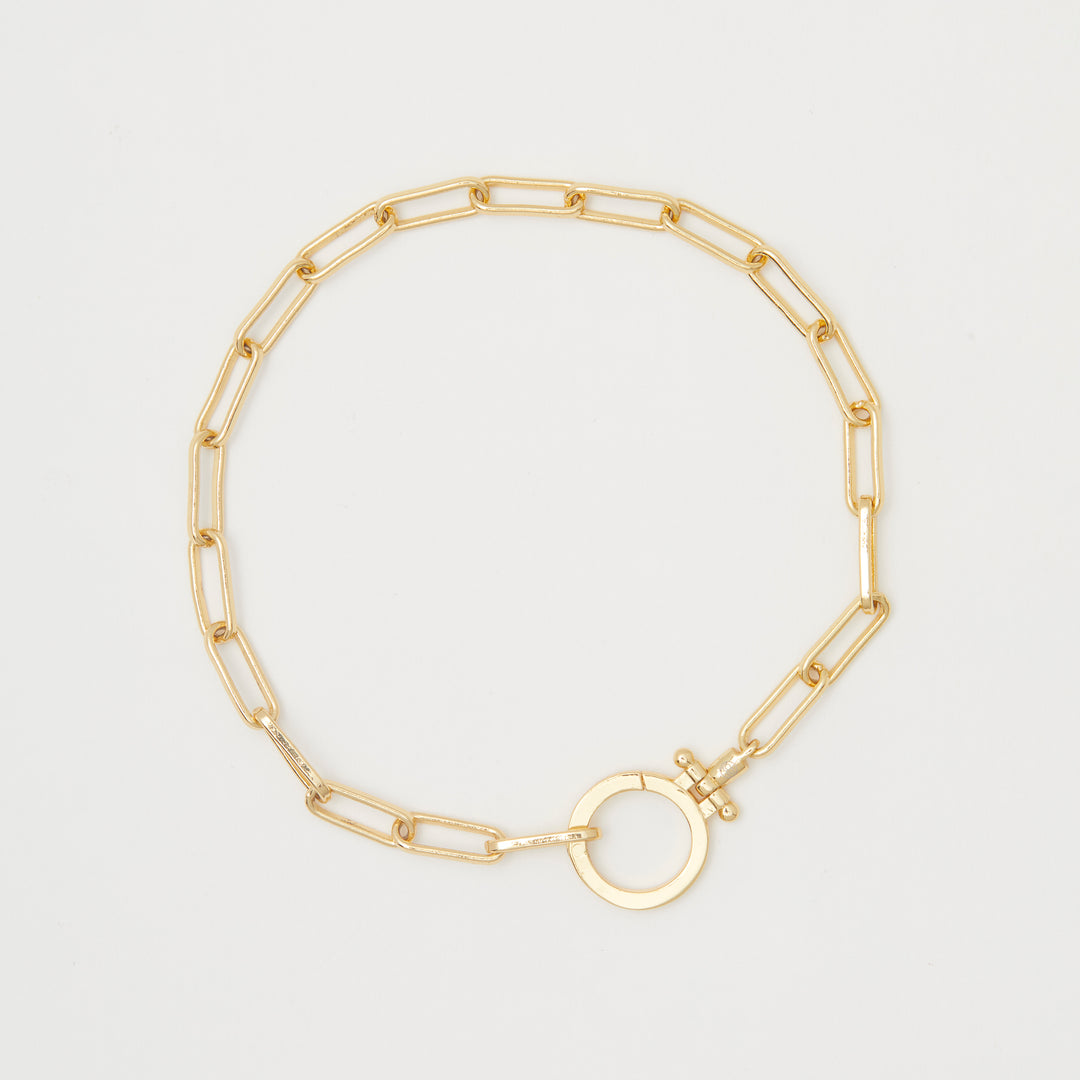 Gorjana Parker Bracelet.  Bold, yet simple, this link gold chain bracelet adds a retro vibe to your summer outfit.  It is eye catching but not overstated or bulky. 7" chain. Clasp measures approximately 3/4". Hinge closure. Available in 18k gold plated brass.