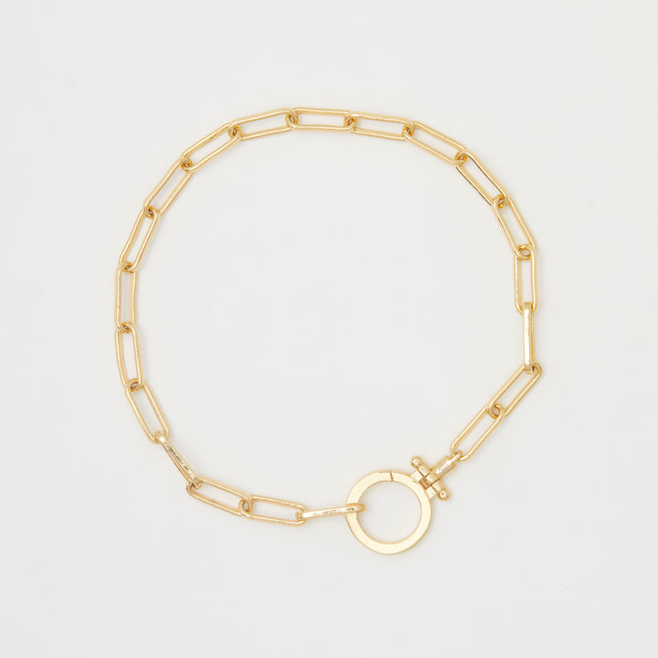 Gorjana Parker Bracelet.  Bold, yet simple, this link gold chain bracelet adds a retro vibe to your summer outfit.  It is eye catching but not overstated or bulky. 7" chain. Clasp measures approximately 3/4". Hinge closure. Available in 18k gold plated brass.